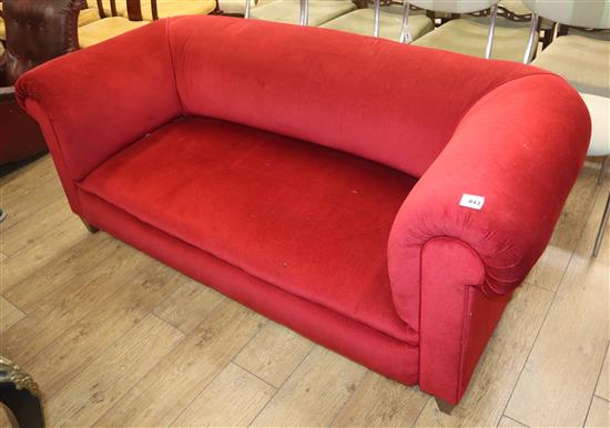 An Edwardian Chesterfield settee upholstered in red dralon W.180cm